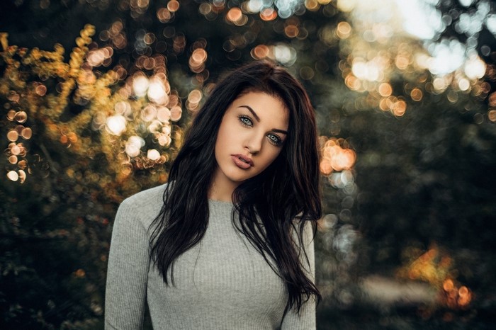 Portrait of a woman with dark hair and blue eyes