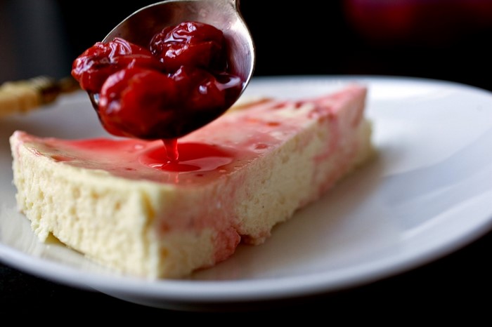 Slice of cheesecake with cherry topping