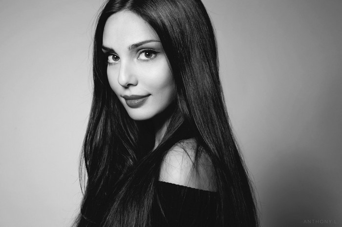 Monochrome portrait of a woman with long black hair