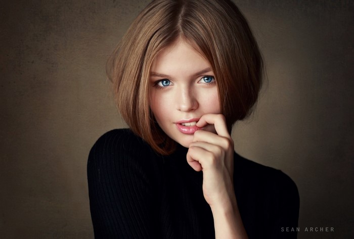 Portrait of a Woman with Blue Eyes and Auburn Hair