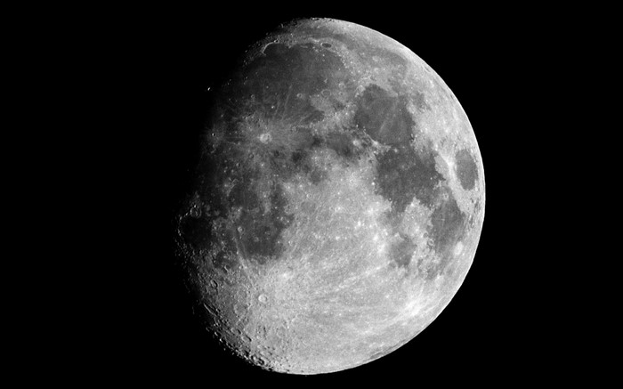 The Moon in black and white against a dark background