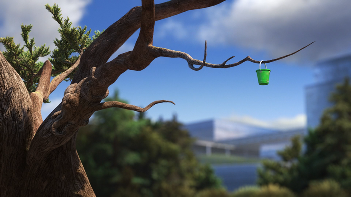 Green bucket hanging from a tree branch