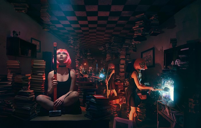 Women with pink wigs in a surreal library setting