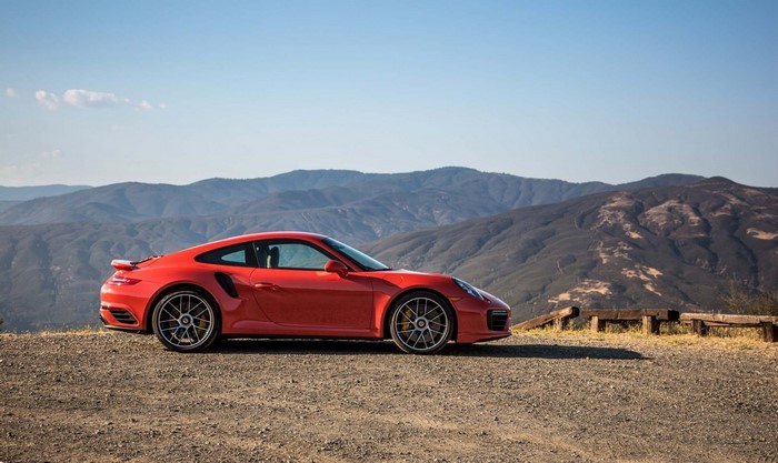 Red Porsche 911 Turbo S 2017 parked on a mountain overlook