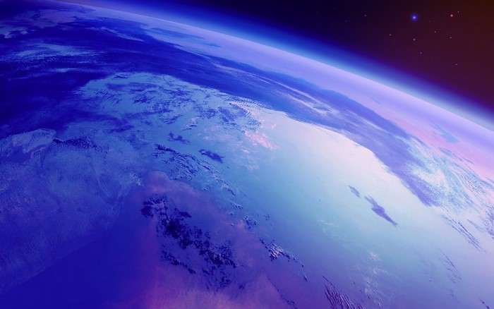 Earth from space with stars and atmosphere
