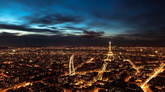 Aerial view of Paris at night with Eiffel Tower