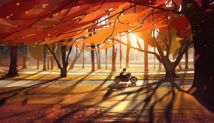 Motorcyclist riding through an autumn park at sunset