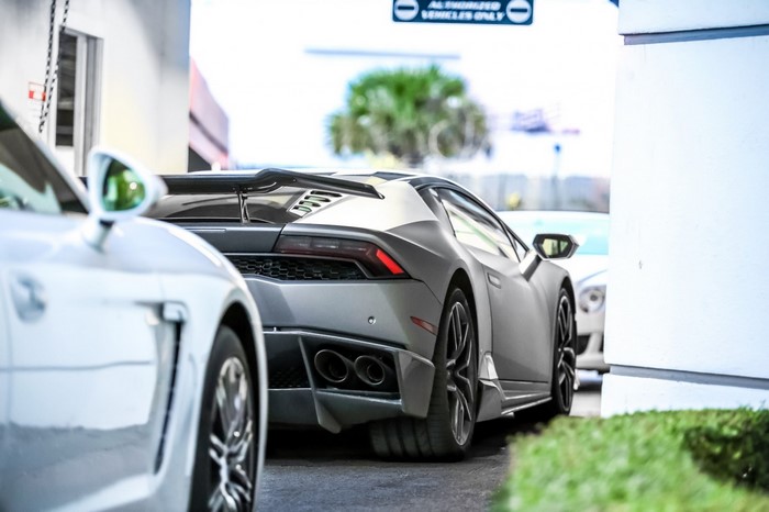 Lamborghini Huracan parked next to a white car