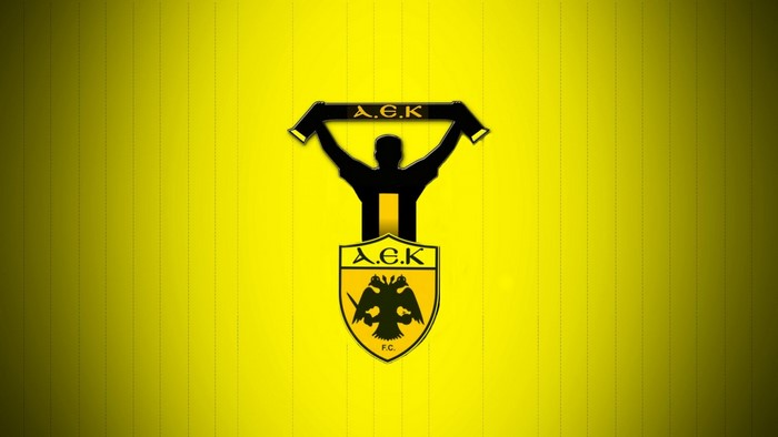 AEK FC logo with fan silhouette on yellow background