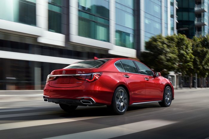 Red 2018 Acura RLX driving on city street