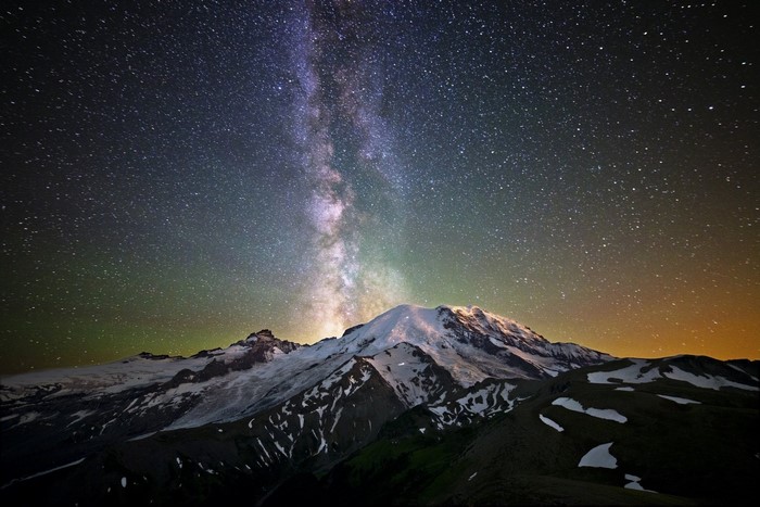 Milky Way over snowy mountains at night
