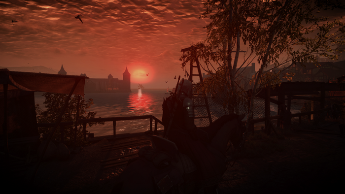 Geralt on horseback at sunset in The Witcher 3