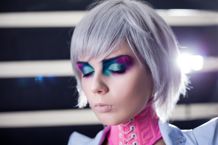 Woman with colorful eye makeup and silver hair