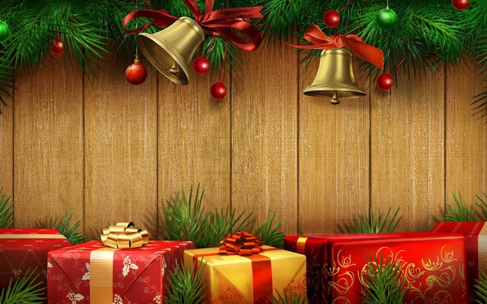 Christmas presents and decorations on wooden background