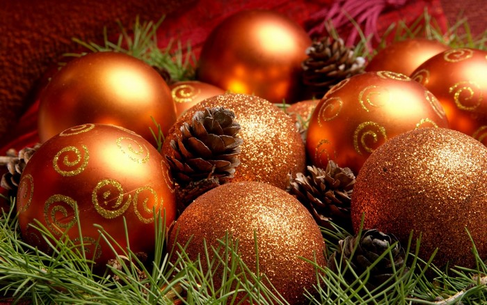 Christmas ornaments and pine cones with pine needles