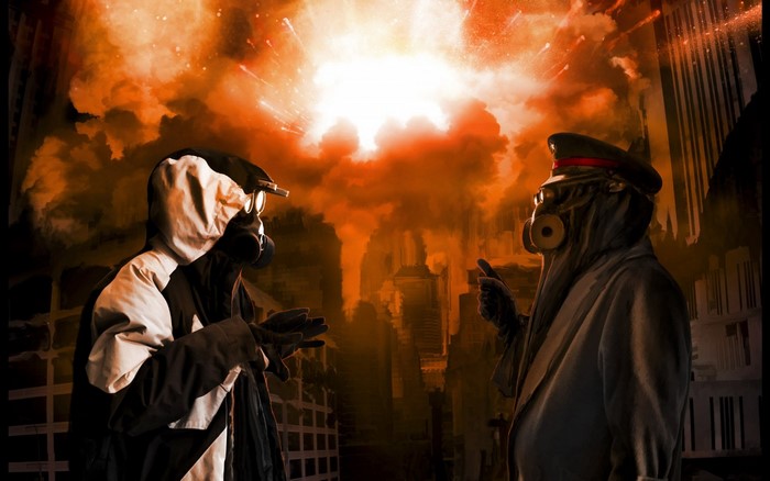 Two figures in gas masks against a fiery explosion