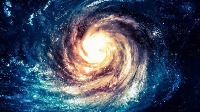 Spiral galaxy with bright core and surrounding nebula