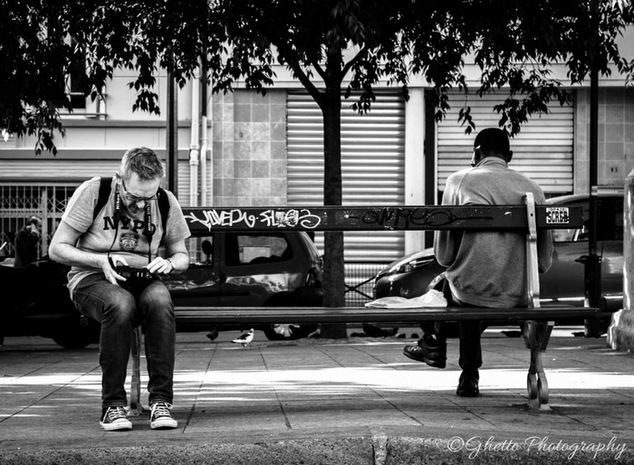 Two men sitting on a bench in New York City