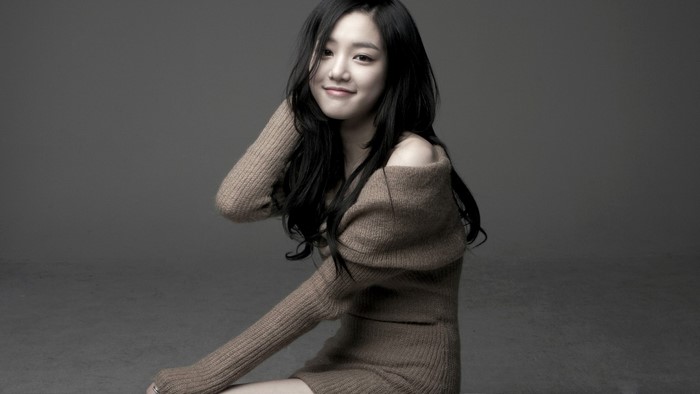 Lee Yu Bi in a brown sweater