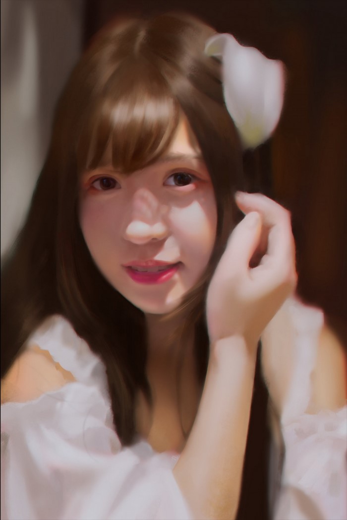 Woman with brown hair and a white flower