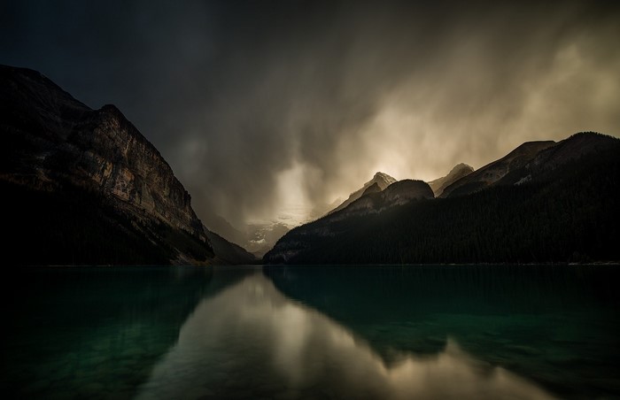 Lake Louise mountains reflection in dark water