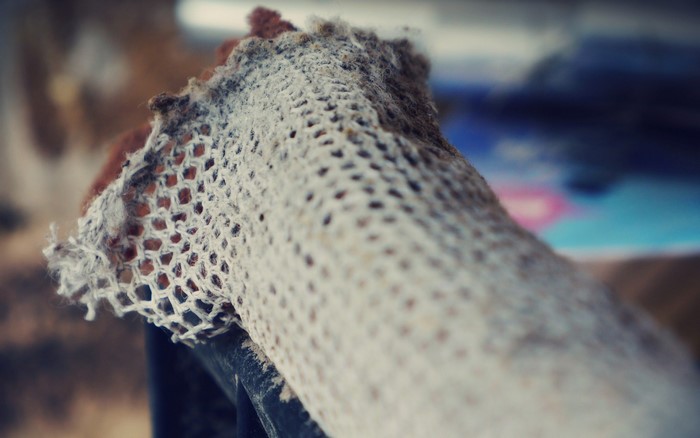 Close-up of a textured, woven material with a honeycomb pattern