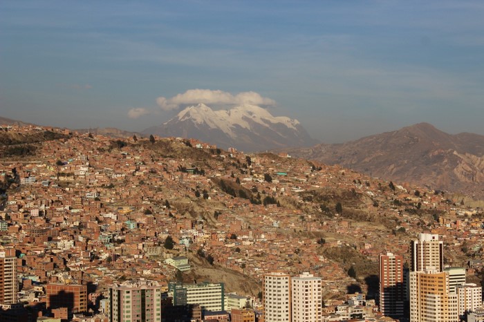 Cityscape of La Paz, Bolivia with snow-capped mountains in the background