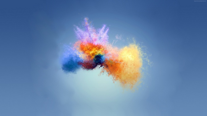 Colorful powder splash on blue background