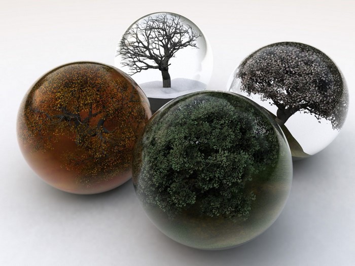 Four spheres with trees representing seasons