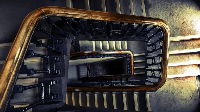 Spiral staircase with wooden handrail