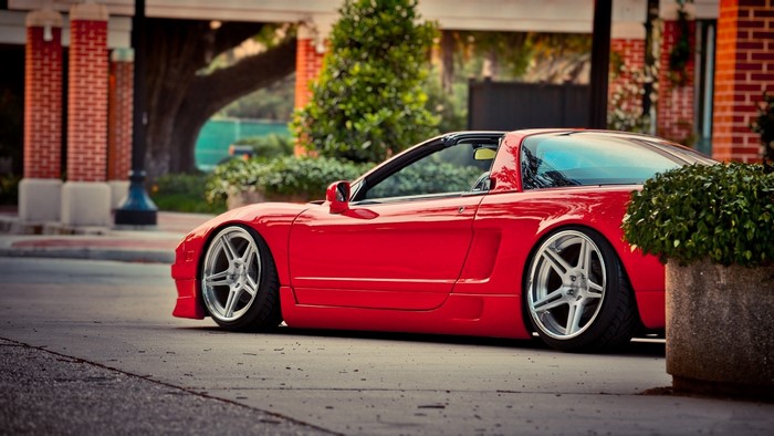 Red Honda NSX sports car on a street