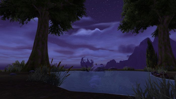Night scene in World of Warcraft with trees and a lake