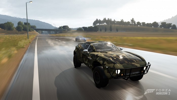 Camouflaged off-road car driving on a wet road in Forza Horizon 2