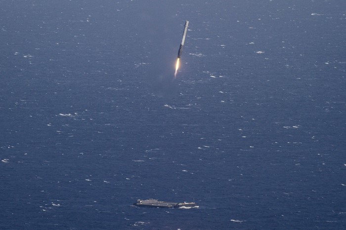 SpaceX Falcon 9 rocket launching over the ocean