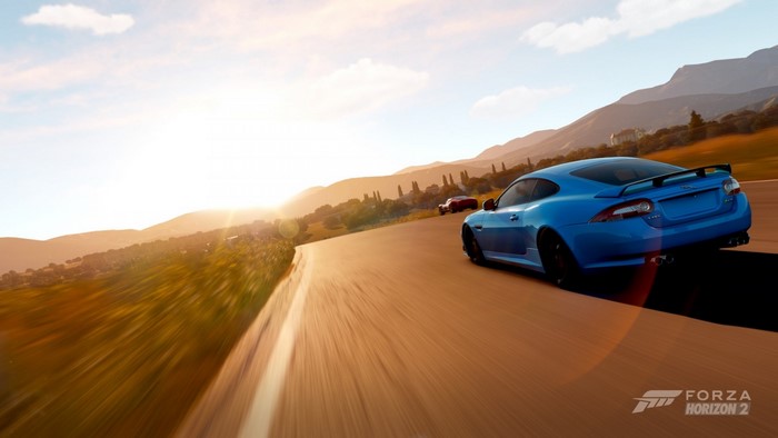 Blue Jaguar sports car driving on a road in Forza Horizon 2