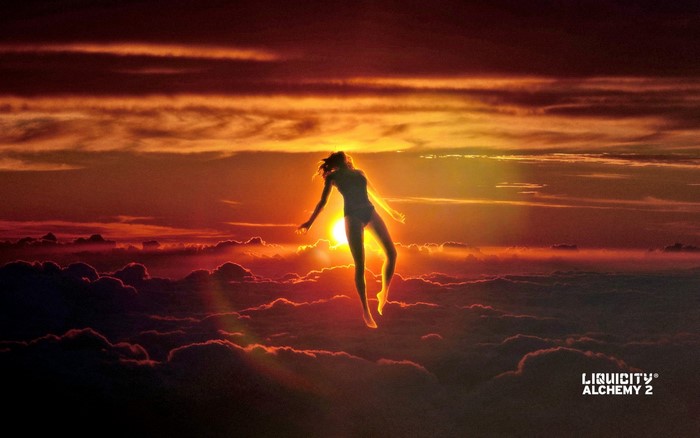 Woman levitating above clouds at sunset