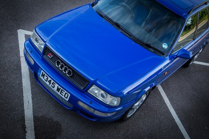 Blue Audi RS2 Avant parked in a parking lot