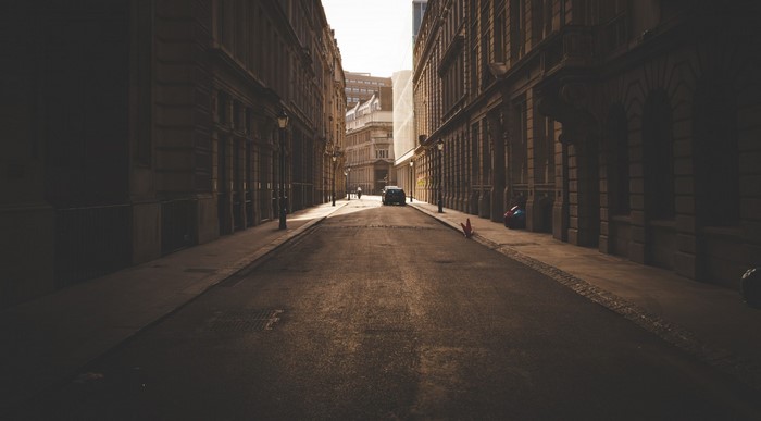 Street with buildings and a car
