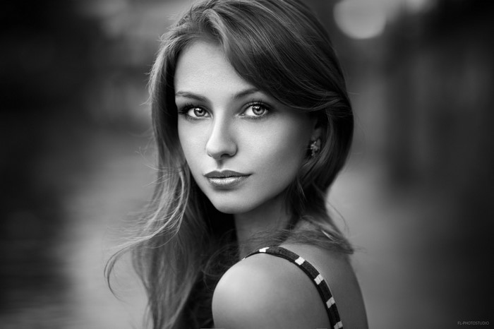 Monochrome portrait of a young woman with long hair