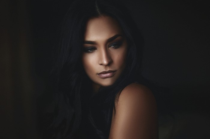 Portrait of a woman with long black hair