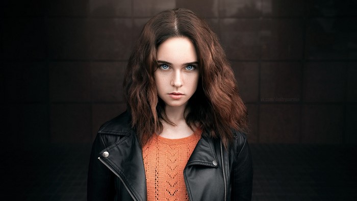 Woman with blue eyes wearing a leather jacket