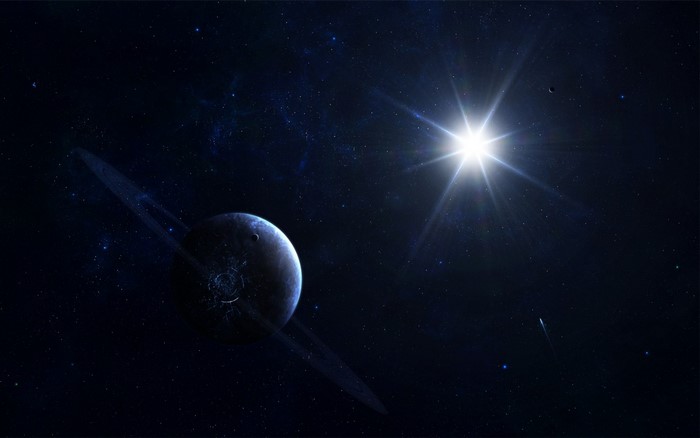 Planet with rings in outer space with a bright star