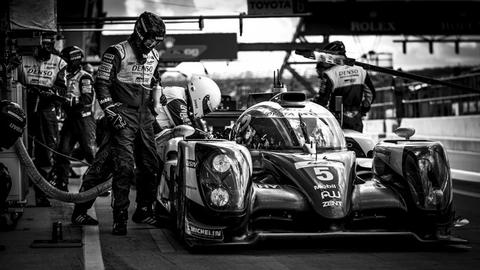 Toyota race car pit stop with crew