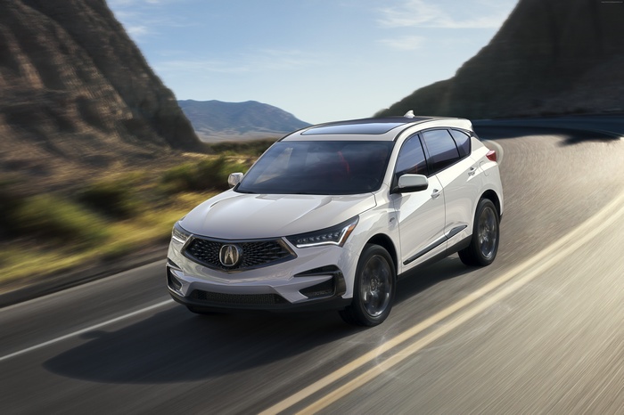 White 2019 Acura RDX driving on a road