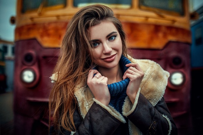 Daria Kodaneva in a fur-lined jacket and blue sweater