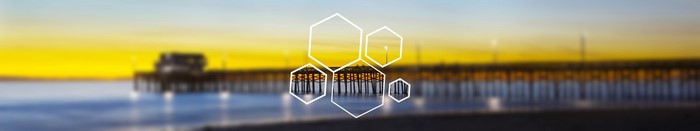 Blurred pier at sunset with hexagonal overlay