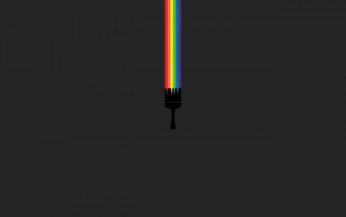Paintbrush with rainbow colors on black background