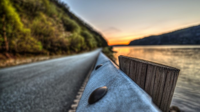 Road by the water at sunset