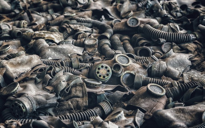 Pile of old, dirty gas masks and hoses