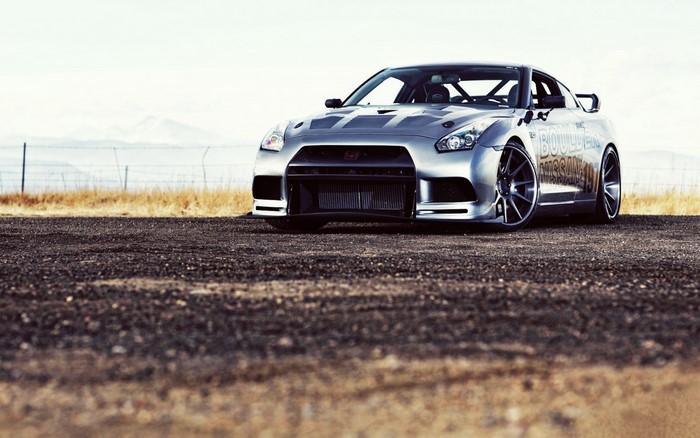 Silver Nissan GT-R R35 on a dirt road